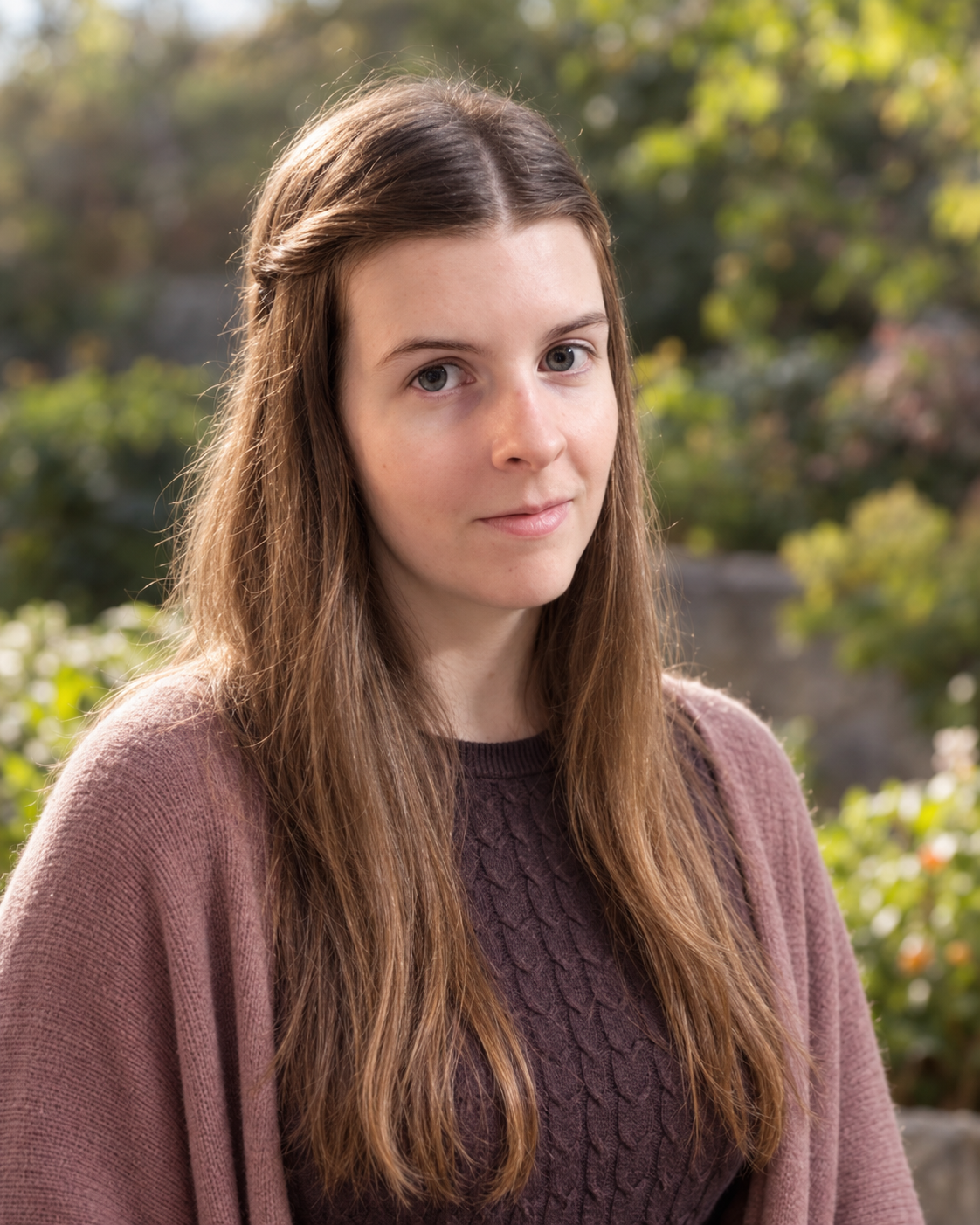 Violet, the person behind Zodyse Astrology, outdoors in a garden